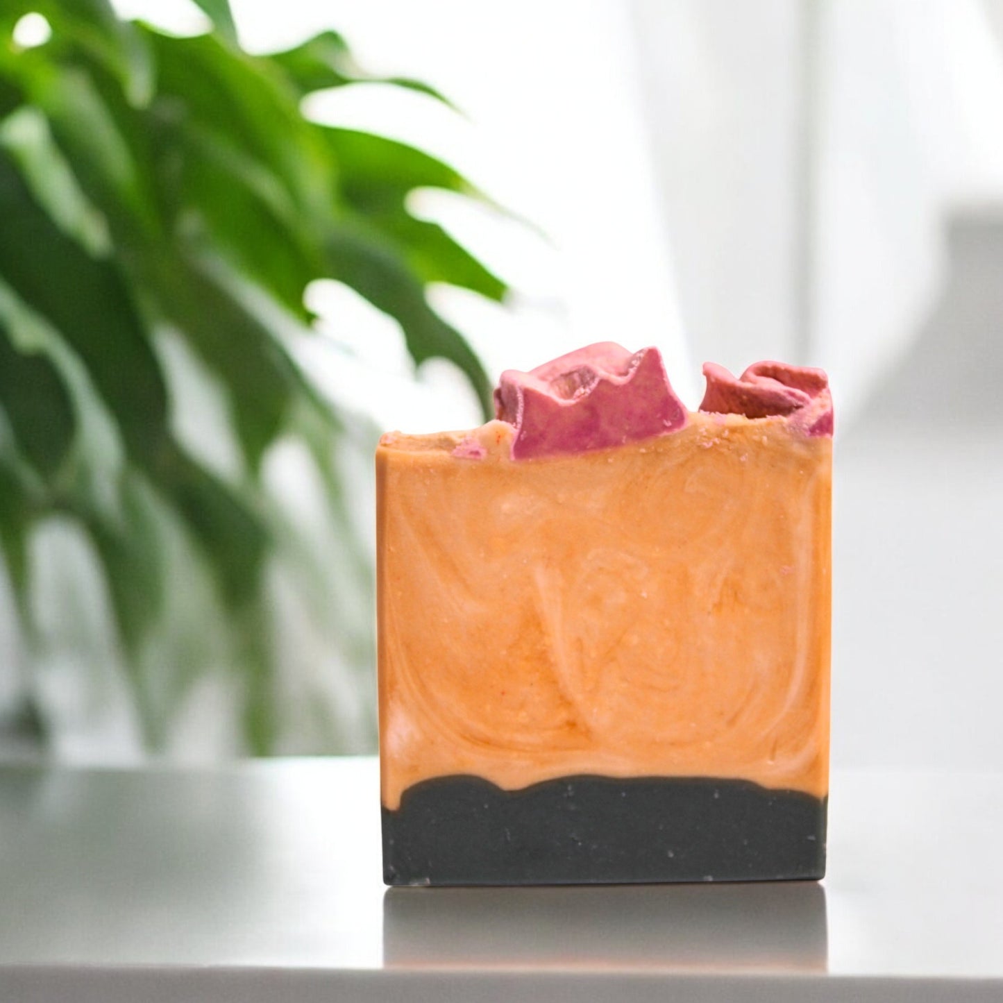 Bar of soap with a natural, textured surface on a blurred background